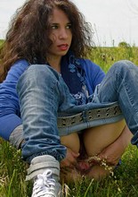 Hairy brunette Idoia toys her pussy with a cucumber and pisses in the country